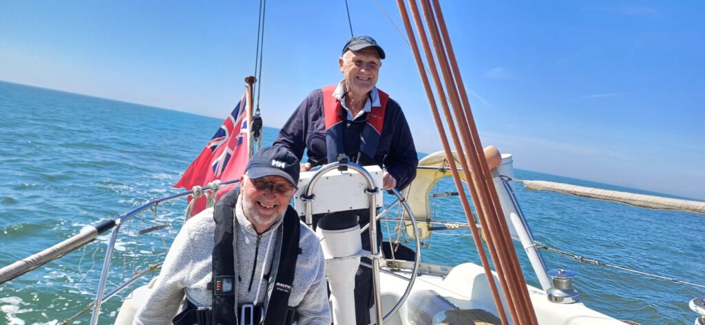Len at the Helm with Tony Enjoying the ride