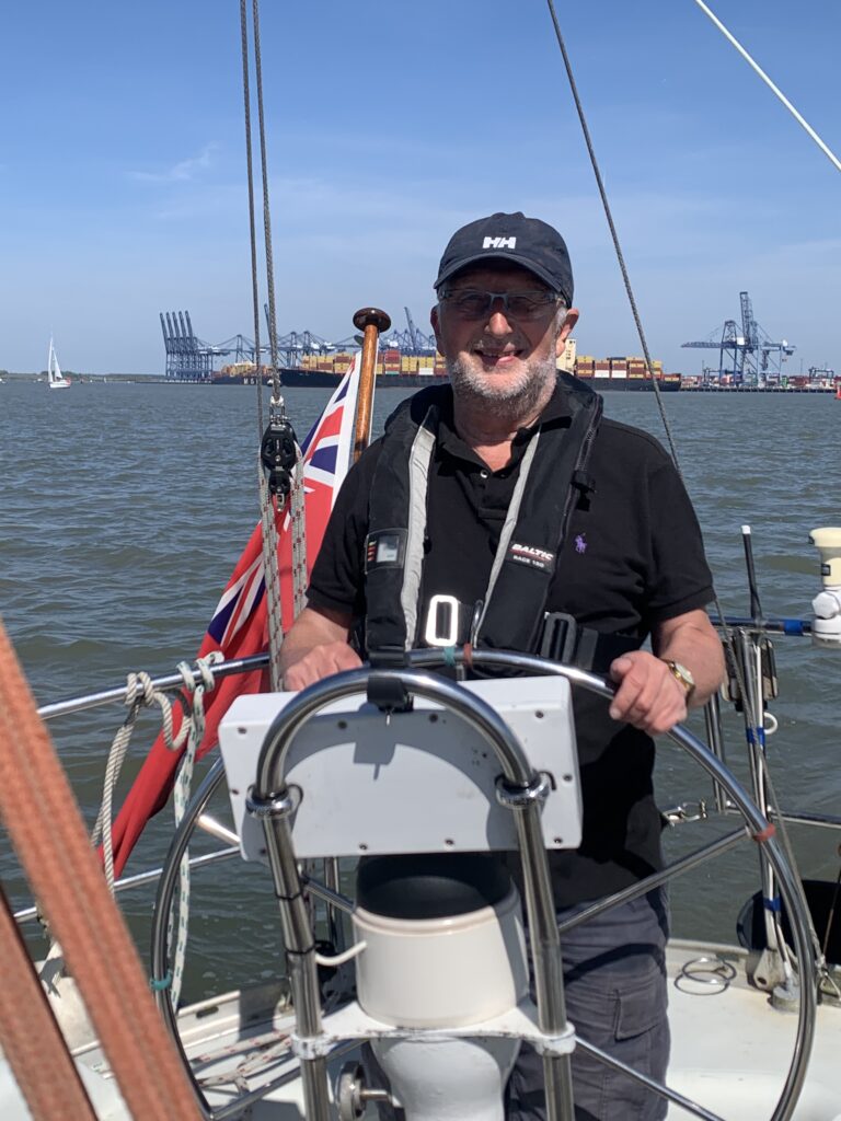 Tony E at the helm with Felixstowe Docks in the background
