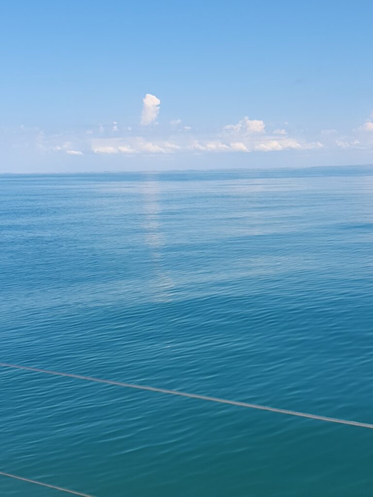 High Cloud over France and reflection on flat English Channel