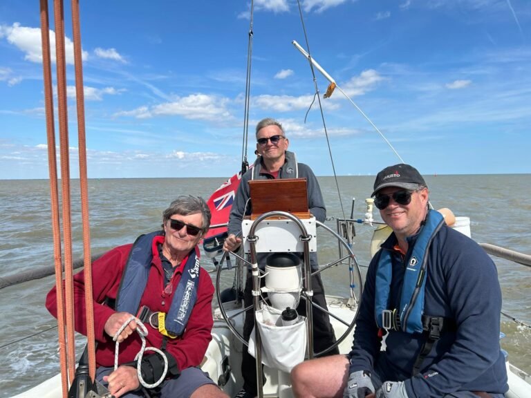 Chris at helm with Mike and Ollie